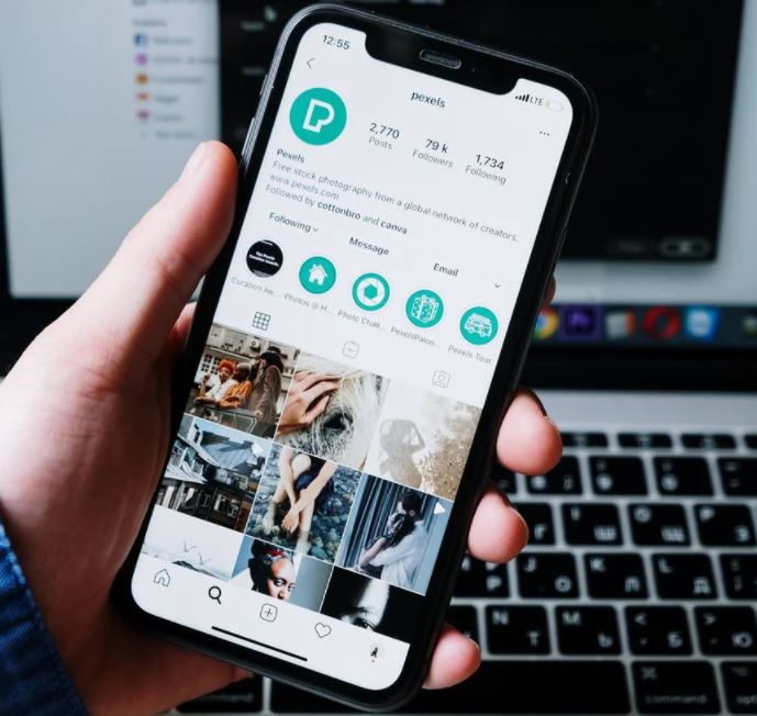 person-holding-black-android-smartphone