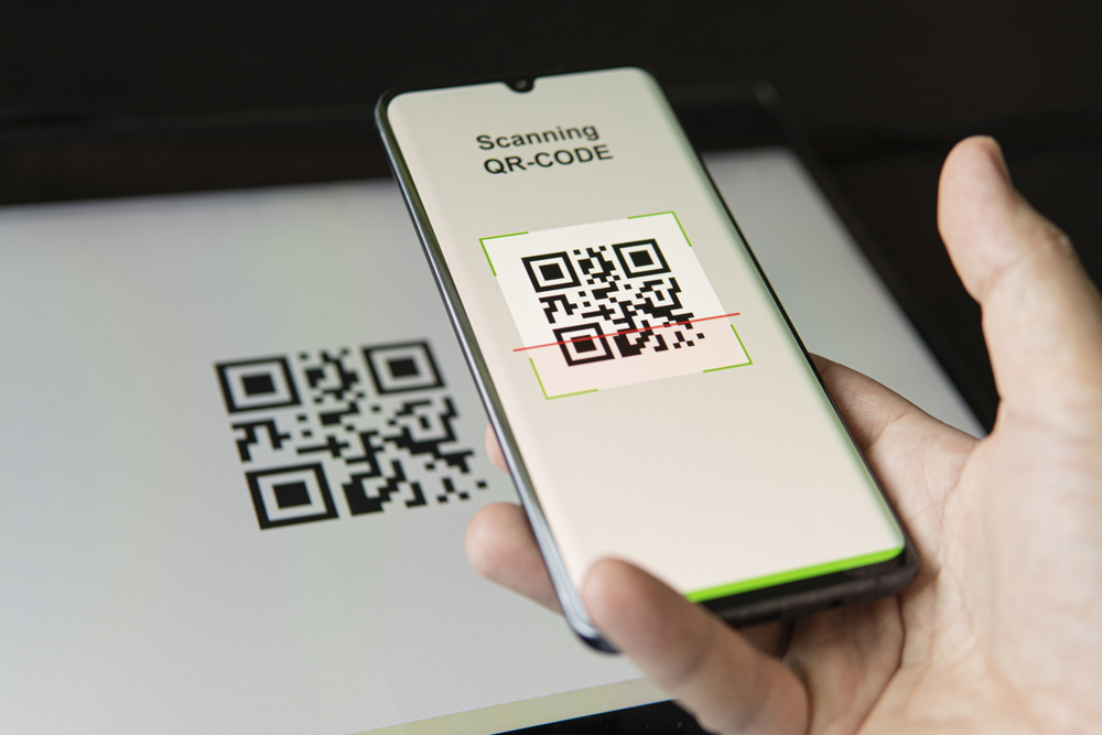 Scanning QR code with mobile smart phone. all the graphics on the screen are made up. checking the qr code on the mobile phone