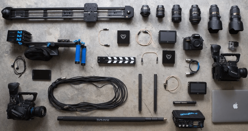 photography equipment, cameras, lenses, wires, laptop
