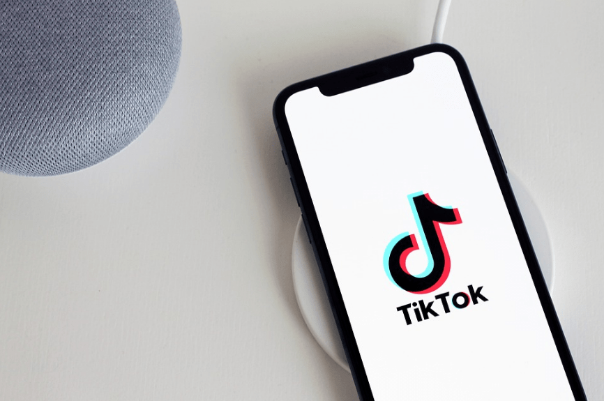 speaker, wireless charger, phone, TikTok logo