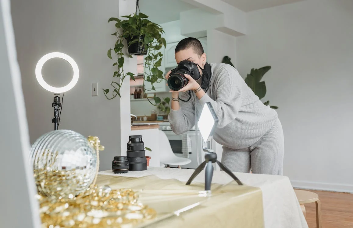 photographer shooting party ball and shiny tinsel placed on the table