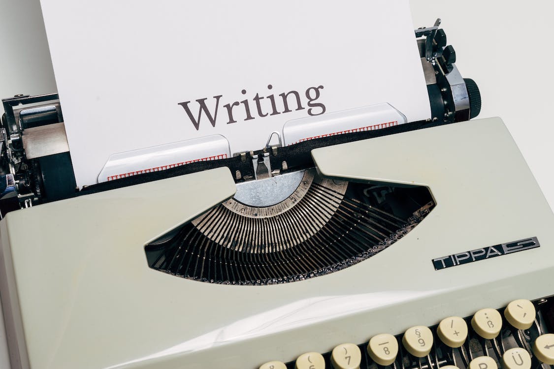 vintage typewriter with white paper
